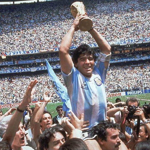 **  FILE  ** Argentina's Diego Maradona, holding up the trophy, is carried on shoulders as he celebrates at the end of the World Cup soccer final game against West Germany at the Atzeca Stadium, in Mexico City, in this June 29, 1986, file photo. Argentina won 3-2. Maradona and Argentinean coach Carlos Bilardo have been asked to lead Argentina by Julio Grondona, head of the Argentine Football Association, Tuesday, Oct. 28, 2008. (AP Photo/Carlo Fumagalli, file)