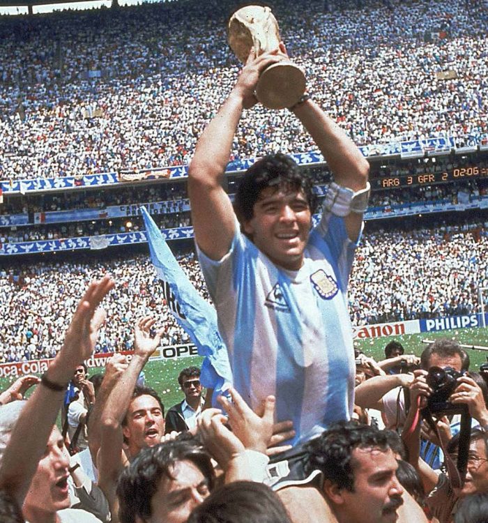 **  FILE  ** Argentina's Diego Maradona, holding up the trophy, is carried on shoulders as he celebrates at the end of the World Cup soccer final game against West Germany at the Atzeca Stadium, in Mexico City, in this June 29, 1986, file photo. Argentina won 3-2. Maradona and Argentinean coach Carlos Bilardo have been asked to lead Argentina by Julio Grondona, head of the Argentine Football Association, Tuesday, Oct. 28, 2008. (AP Photo/Carlo Fumagalli, file)